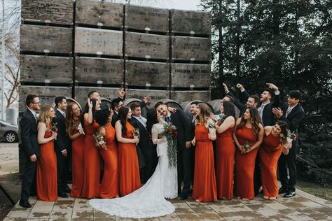 Burnt orange is probably my top favorite color for bridesmaids dresses! These simple, modern bridemaids dresses complimented this boho wedding dress perfectly. A gorgeous combo with the guys wearing simple black tuxedoes, with a Californian winery backdrop! #autumncolorpalette #californiawinerywedding #burntorangebridesmaidsdress Black Gold Burnt Orange Wedding, Rust Orange And Black Wedding, Burnt Orange And Black Wedding Theme, Black Burnt Orange Wedding, Black And Orange Fall Wedding, Black Red And Orange Wedding, Orange And Black Wedding Theme, Black And Orange Wedding Theme, Rust Orange Wedding Color Combos