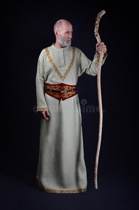 Old Wise Wizard Holds A Wooden Magic Staff Stock Image - Image of male, hair: 201018777 Tunic Designs Men, Man Holding Staff Reference, Holding A Staff Reference, Holding Staff Pose Reference Drawing, Man Holding Staff Pose Reference, Person Holding Staff Reference, Wizard Cosplay Men, Wizard Poses Reference Male, Person With Staff Reference