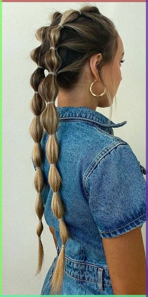 This hairstyle features two bubble braids running parallel down the back, creating a symmetrical and sleek look. The bubbles are secured with clear elastics, allowing the natural highlights in the hair to take center stage. This style pairs perfectly with casual outfits, like the denim jacket seen in the image, making it an ideal choice for everyday wear. The double braids provide a structured yet relaxed appearance, perfect for long hair and an easy, quick style that can be done in a matter of minutes. Long Bubble Braid, Bubble Braid Pigtails, Braid Pigtails, Softball Hair, Concert Hairstyles, Bubble Braid, Softball Hairstyles, Old Hairstyles, Sport Hair