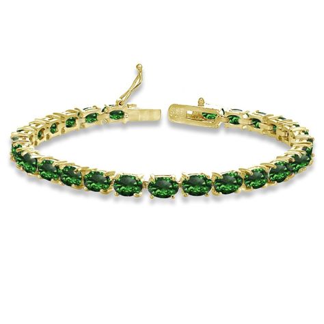 PRICES MAY VARY. FEATURE - This attractive tennis bracelet displays 6x4mm oval prong set simulated emerald gemstones. This gemstone bracelet in fine jewelry is a great addition to your emerald jewelry and emerald gemstone jewelry collection; it will enhance your daytime and evening attire. It can be purchased as tennis bracelets for women and tennis bracelets for teen girls. CRAFTED - The simulated emerald gemstone tennis bracelet is created of fine yellow gold flashed .925 sterling silver, nick Birthstones Jewelry, Birthstones Meanings, Bracelet Displays, Tennis Style, Birthstone Rings, Emerald Bracelet, Gems Bracelet, Stones Jewelry, Birthstone Colors