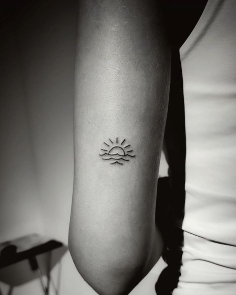 Capturing Nature's Harmony: Explore the Symbolism of Wave and Sun Tattoos in Our Latest Blog. Dive into Tranquility and Renewal. Sun Always Rises Tattoo, Sun Water Tattoo Design, Sunrise Over Waves Tattoo, Wave Sun Tattoo Simple, Small Tattoo Ideas Nature, Sun And Wave Tattoo Ankle, Sunset And Waves Tattoo, Sun Horizon Tattoo, Ocean Hip Tattoos Women