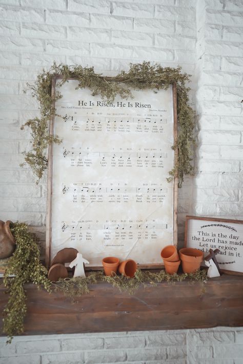 Christ centered Easter decor for mantle. He is risen sheet music DIY sign. Easy DIY sign for easter. DIY Christ cetnered Easter decor Lds Easter Decor, Easter Sunday Church Decoration Ideas, Easter Jesus Decorations, Christ Easter Decorations, Spring Church Decorations, Diy Christian Easter Decor, Easy Spring Decor Diy, Easter Decor Mantle, Classy Spring Decor