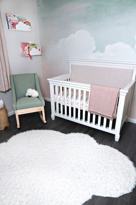 A gorgeous and calming cloud nursery. This sweet girl nursery has a beautiful hand painted sky mural and sweet bird art. #cloudnursery #girlnursery #MDBCstyle #girlnurseryinspo #nurseryinsipration #pinknursery #DarlingtonCrib Clouds For Nursery, Cloud Accent Wall Nursery, Sky Mural Wall, Sky Nursery Theme Girl, Diy Cloud Mural, Cloud Mural Nursery, How To Paint Clouds On A Wall, Nursery Sky Theme, Baby Girl Nursery Mural