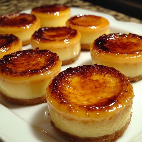 Mini Creme Brulee Cheesecakes Decadent Mini Creme Brulee Cheesecakes with Caramelized Sugar Topping Ingredients: 1 cup crushed graham crackers 1/4 cup melted butter 8 oz cream cheese, softened 1/2 cup granulated sugar 2 large eggs 1 tsp vanilla extract 1/2 cup heavy cream 1/4 cup milk 1/4 cup granulated sugar (for caramelizing) Directions: Preheat your oven to 325°F (163°C). Combine crushed graham crackers and melted butter. Press the mixture into the bottom of mini cheesecake pans. In a ... Cream Brulee Cheesecake, Mini Creme Brulee, Mini Cheesecake Pan, Creme Brulee Cheesecake, Raspberry Tarts, Rich Desserts, Caramelized Sugar, Elegant Desserts, Incredible Recipes