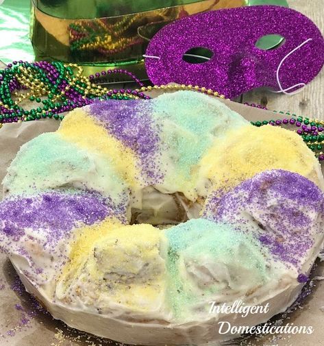 King Cake easy recipe using store bought Cinnamon Rolls and Icing. King Cake is a New Orleans Mardi Gras sweet treat favorite. The recipe is super easy to make and scrumptious. Make more than one because it vanishes quickly. #kingcake #mardigras What Is Mardi Gras, New Orleans King Cake, Tea Party Menu, King Cake Recipe, Mardi Gras Centerpieces, Jenny Cookies, Strawberry Butter, Mardi Gras King Cake, Strawberry Dessert