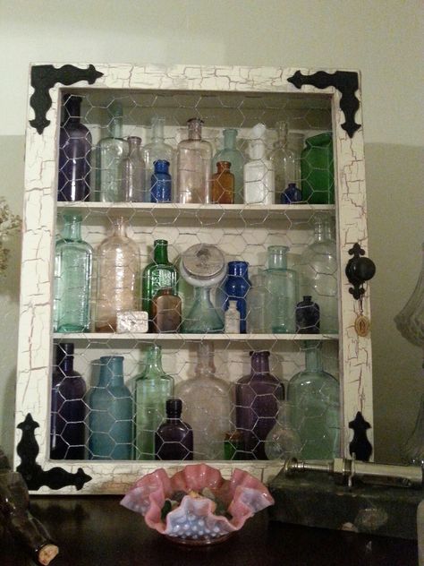 Crackle paint, chicken wire cabinet for antique bottle display Old Bottle Display Ideas, How To Display Old Bottles, Vintage Bottles Display, Old Glass Bottles Ideas Display, Decorating With Old Glass Bottles, Antique Bottle Display Ideas, Vintage Bottle Display Ideas, Displaying Old Bottles, Vintage Bottle Display