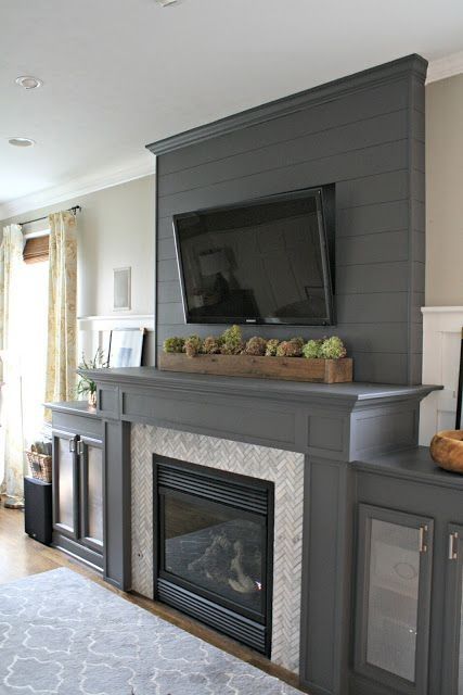 How to Makeover Your Fireplace with DIY Ideas - GODIYGO.COM Grey Painted Fireplace, Gray Fireplace, Fireplace Transformation, Fireplace Marble, Grey Fireplace, Fireplace And Tv, Tv Over Fireplace, Paint Fireplace, Fireplace Tv Wall