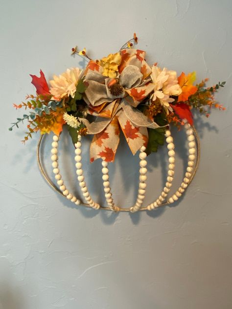 Unique wreathe created with a wire pumpkin frame and beading with Jute. A wired bow and florals added for a beautiful door hanger as well as a wall decoration. these wreathes will be lovely throughout fall and Thanksgiving. We now offer Local Pickup for all items!  If you're in the area, you can save on shipping and pick up your order directly from us. Simply  message before placing an order. Thank you Julia Lee 1945 Terry Ln De Pere WI   54115 julialee644@yahoo.com Color Variations:* Please not Pumpkin Reef, Wreath Ring Ideas, Diy Fall Crafts For Adults, Pumpkin Frame Wreath, Wire Pumpkin Wreath Diy, Wire Pumpkin Wreath, Beaded Wreaths, Wire Wreaths, Pumpkins Crafts