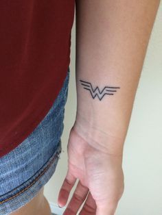 Minimalist simple Wonder Woman logo tattoo Woman Wrist Tattoo, Wonder Woman Tattoo, Animal Tattoos For Women, Minimalist Tattoo Meaning, Tattoo Catalog, Cool Wrist Tattoos, Marvel Tattoos, Woman Tattoo, Wonder Woman Logo