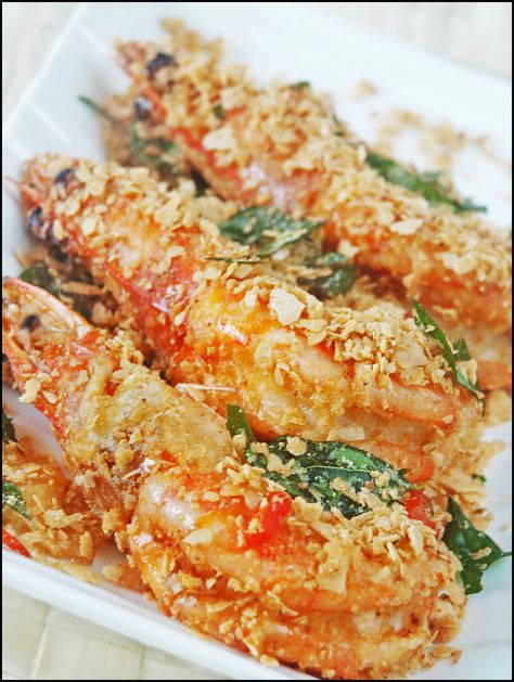 CEREAL BUTTER PRAWNS (Recipe for 2-4 persons)  Cereal mix ¾ cup Nestum cereal (original flavour) ½ tsp salt 1½ tsp sugar 1½ tbsp milk powder  300 g medium size prawns (8 pieces) trim, devein, wash, and dry thoroughly 1 tsp salt ½ egg, beaten 1½ tbsp plain flour  vegetable oil for deep-frying 30 g unsalted butter (2 tbsp) 1 bird's eye chilli, thinly sliced 6-10 sprigs curry leaves rinse and dry with paper towels; discard stalks to yield about 1/8 cup How To Make Cereal, Butter Prawns, Butter Prawn, Sambal Recipe, Singaporean Food, Prawns Recipe, Prawn Dishes, Cereal Mix, Malaysian Recipes