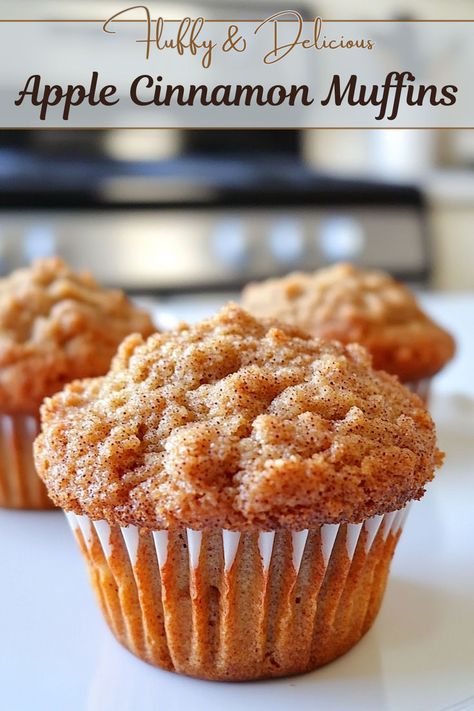 An apple cinnamon muffin placed on a white countertop Apple Biscuits Recipes, Apple Breakfast Muffins, Cinnamon Muffins Easy, Cinnamon Muffins Recipe, Apple Banana Muffins, Banana Cinnamon Muffins, Apple Cinnamon Muffins Recipe, Easy Muffin Recipe, Cinnamon Desserts