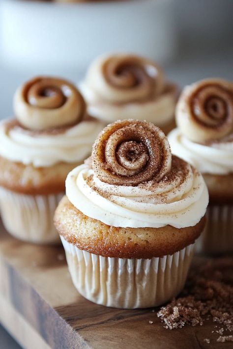 These moist cinnamon roll cupcakes topped with rich cream cheese frosting and mini cinnamon rolls are the ultimate sweet treat for any occasion! Cinnamon Roll Bakery, Cinnamon Roll Cupcake, Cinnamon Cupcakes Recipe, Flavor Cupcakes, Deserts With Cream Cheese, Cupcake With Cream Cheese Frosting, Cowboy Cupcakes, Cinnamon Roll Cupcakes, Cinnamon Roll Frosting