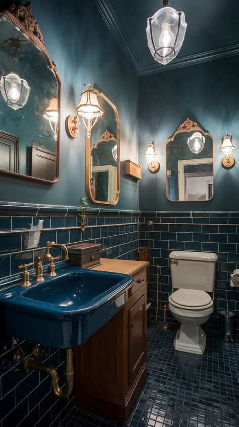 Explore 17 stunning moody vintage bathroom ideas that combine timeless elegance with dramatic charm. From antique fixtures to rich, dark tones, these designs will inspire a sophisticated makeover for your bathroom. Perfect for those seeking a cozy yet vintage aesthetic. Bathroom Whimsigoth, Vintage Maximalist Bathroom, Navy Blue Tile Bathroom, Wizard Bathroom, Moody Half Bathroom Ideas, Fun Guest Bathroom, Elegant Half Bathroom Ideas, Speakeasy Bathroom, Moody Blue Bathroom