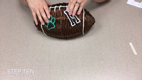 Create a Football Wreath with Kristin from Mogadore Branch Library | I found a nifty (and thrifty) football wreath form at the Dollar Tree and as a football fan, I just had to have it. I created this virtual craft... | By Mogadore Branch Library How To Make A Football Wreath, Football Shaped Wreath, Football Wreath Form, Football Wreath Diy, Football Crafts, Football Diy, Football Wreath, Wire Wreath Frame, Wire Wreath