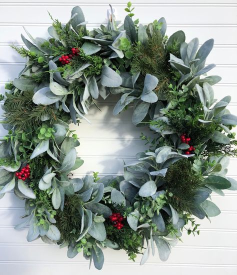 "READY TO SHIP! THIS ITEM WILL BE SHIPPED WITHIN 1 - 3 DAYS OF ORDERING. Holiday Faux Lambs ear and eucalyptus with mixed pine and berries farmhouse wreath This gorgeous grapevine wreath makes a festive and elegant first impression when guests arrive to your home. This lush and full wreath is designed using a combination of assorted greens including faux Lamb's Ear and Eucalyptus. Additional faux mixed pines including faux cypress with red berries are perfectly interspersed around the whole of t Wreath Stand, Lamb's Ear, Wreath Hanger, Lambs Ear, Wreath Christmas, Farmhouse Wreath, Winter Wreath, Red Berries, First Impression