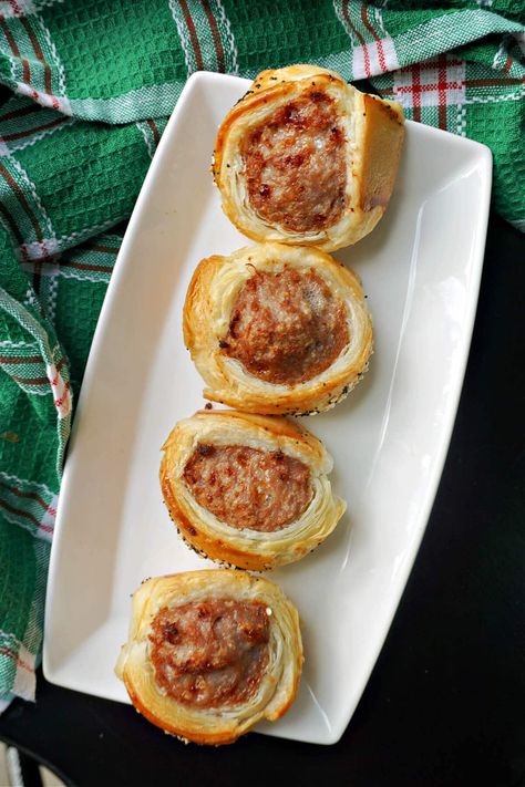 Mini Sausage Rolls, a delicious appetizer or snack for all occasions. They are super easy to make using shop-bought sausagemeat and puff pastry, with a sprinkle of sesame and poppy seeds. These bites are super popular with all ages, and make the ideal snack for any party, celebration or picnic. Mini Sausage Rolls, Savoury Bites, Homemade Sausage Rolls, Brunch Appetizers, Meat Rolls, Sausage Bake, Delicious Appetizer Recipes, Popular Snacks, Finger Foods Easy