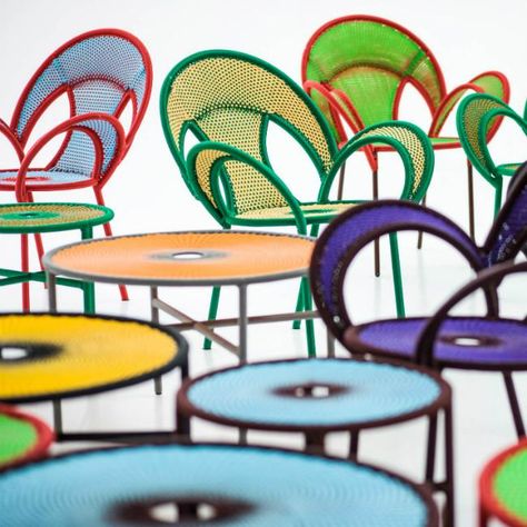 Banjooli Outdoor Side Table by Moroso Designed by: Sebastian Herkner Dimensions: Low Table: 19 3/4"Diam x 15"H High Table: 19 3/4"Diam x 18"H Materials: Polyethylene cord hand woven on tubular steel frame Made in: Senegal The shape of the table is inspired by the mating dance of male ostriches –banjooli in the Wolof language- who stretch out their wings to show off their beauty to the female. Banjooli is part of M’Afrique, a range of tables conceived by the designer and produced by African craft Colorful Outdoor Furniture, Table Rose, Colorful Patio, Sebastian Herkner, Car Furniture, African Crafts, Outdoor Coffee Table, Low Table, High Table