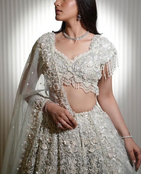 Ivory ensemble at Designs by Kaur to make you the spotlight for your special day. ✨ Contact us today at 437-994-4243 or come visit our designer studio at 14 Hobart Gardens, Brampton. #designsbykaur #ivory #ivorylehenga #indianbride #reception #lehenga #punjabibride #bride #wedding Bride Collection, Reception Lehenga, Punjabi Bride, Lehenga Blouse Designs, Engagement Outfit, Jewellery Indian, Designer Studio, Lehenga Blouse, Engagement Outfits