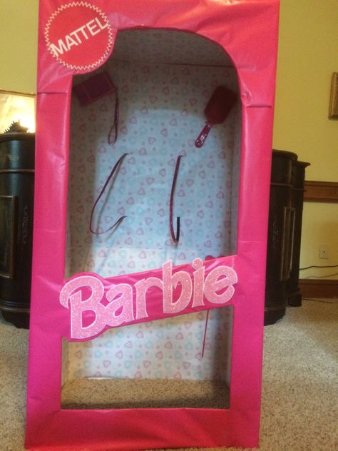 "Barbie in a box" costume made from wardrobe box from Home Depot and pink wrapping paper from $1 store.  Lettering was handout from craft paper and Mattel was a blow up from internet.  The back pack straps are belts from $1 store as well as the Barbie accessories attached. Barbie Box Halloween Costume, Barbie Costume Box Diy, Barbie Costume Accessories, Barbie In A Box Costume, Diy Barbie Box Costume, Barbie Costume Kids, Barbie Box Diy, Diy Barbie Costume, Barbie Box Costume