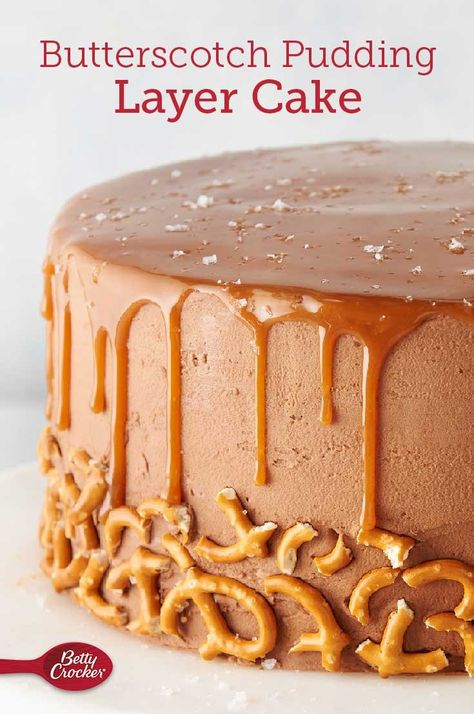 If you love butterscotch, you’re going to want a slice (or two!) of this incredible pudding layer cake. Made easy with Betty Crocker™ Super Moist™ yellow cake mix, this cake’s three layers are given extra flavor with milk, melted butter and butterscotch pudding mix. The layers are separated by a from-scratch butterscotch-dark chocolate buttercream frosting that’s then used to frost the entirety of the cake. Butterscotch Pudding Cake Recipe, Pudding Layer Cake, Butter Scotch Cake, Buttercream Recipes, Betty Crocker Cake Mix, Moist Yellow Cakes, Betty Crocker Cake, Simple Desserts, Cake Mix Ingredients