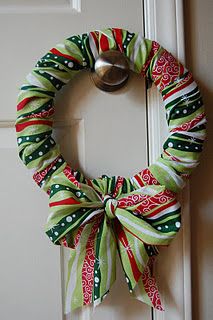 Christmas fabric wreath- with pizza box base!!! Wreaths With Fabric, Fabric Christmas Wreath Diy, Fabric Wrapped Wreath, Christmas Fabric Wreaths, Fabric Wreaths Diy No Sew Tutorials, Cloth Wreaths Fabric Scraps, Fabric Wreaths Diy No Sew, Twine Projects, Fabric Wreaths