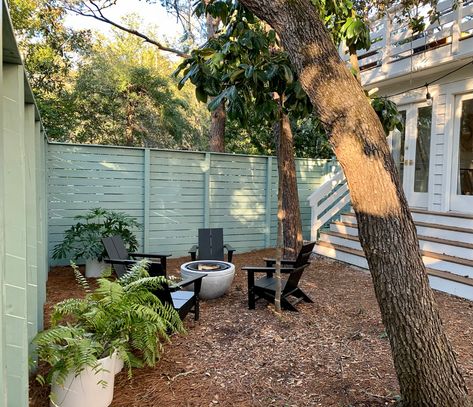 How We Created A Cozy Fire Pit Area In Our Formerly Boring Side Yard | Young House Love Mulched Backyard, Cozy Fire Pit Area, Halcyon Green, Adirondak Chairs, Cozy Fire Pit, Backyard Fire Pit, Green Fence, Hanging Tent, Garden Balls