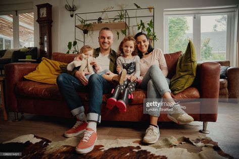 Portrait Of Happy Family Posing On The Couch Together At Home In Living Room During Quarantine High-Res Stock Photo - Getty Images Family Photo Poses On Couch, Family On Couch Photography, Family Portrait Living Room, Family Couch Photoshoot, Living Room Family Photoshoot, Hipster Interior, Sitting On Couch, Family Potrait, Family Sofa