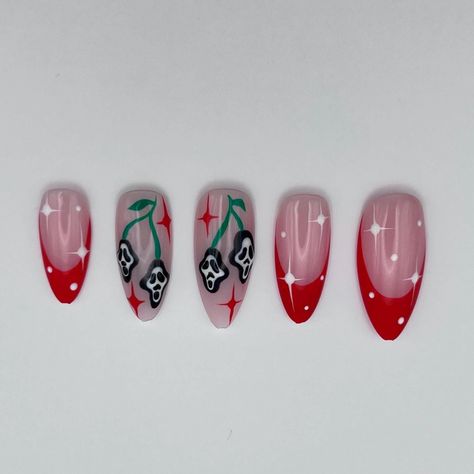 Halloween but make it  girly  Scream inspired cherry nails. 2 accent nails featuring scream mask cherries and red sparkles. Complimentary French tips with white sparkles complete this super cute halloween design. This design is fully customisable, select your perfect base colour and desired French tip colour (red, green or white) to create your perfect halloween nails. base colour in photos is shade 6 DISCLAIMER! nails are hand painted to design and colours may differ may photos Red Nail Halloween Designs, Ghostface Cherry Nails, How To Do Cherry Nails, Red And White Cherry Nails, Ghost Face Cherry Nails, Cherry Red Halloween Nails, Cherry Skull Nails, Skull Cherry Nails, French Tip Colour