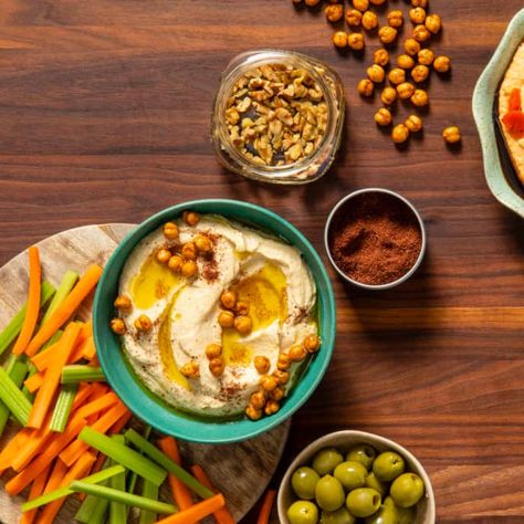 Homemade or store-bought hummus is delicious, but why not kick it up with fun, flavorful toppings? Read on for some of our favorites. Make Your Own Hummus, White Bean Hummus, Roasted Red Pepper Hummus, Red Pepper Hummus, Spiced Beef, Olive Salad, Homemade Hummus, America's Test Kitchen, Hummus Recipe