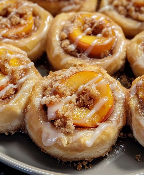 Peach Cobbler Cinnamon Rolls Peach Rolls, Peach Breakfast Recipes, Strawberry Cream Cheese Stuffed French, Peach Cinnamon Rolls, Stuffed Cinnamon Rolls, Cinnamon Roll Cups, Peach Cobbler Cinnamon Rolls, Cream Cheese Stuffed French Toast, Breakfast Roll