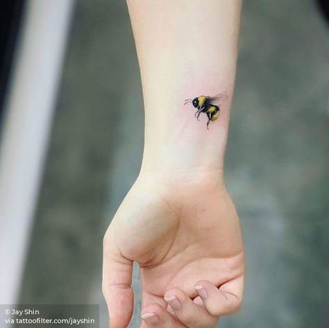 Humblebee tattoo on the wrist. Bee Wrist Tattoos For Women, Bee Tattoo On Wrist, Little Bee Tattoo, Tattoo On The Wrist, Small Animal Tattoos, Animal Tattoos For Men, Bee Tattoos, Tattoo On Wrist, Single Needle Tattoo