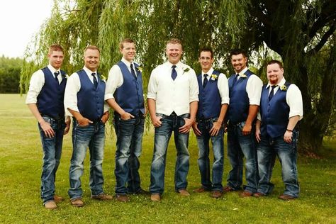 Groom With Jeans And Vest, Navy Vest With Jeans Groomsmen, Groomsmen In Jeans And Vests, Groomsmen Attire May Wedding, Mens Wedding Attire Jeans And Vest, Mens Wedding Vest And Jeans, Country Fall Wedding Groomsmen Attire, Country Wedding Attire For Men, Navy Blue Vest Groomsmen With Jeans