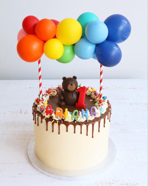 Rainbow Balloon Garland Teddy Bear First Birthday Cake #firstbirthdaycake #balloongarland #balloongarlandcake #teddybearcake #firstbirthdayparty #rainbowcake #rainbowfirstbirthday Bear First Birthday Cake, Cake Shop Names, Teddy Bear First Birthday, Birthday Cake With Balloons, Birthday Cake Balloons, Rainbow Balloon Garland, Cake Designs For Kids, Fruit Birthday Party, Cakes Inspiration