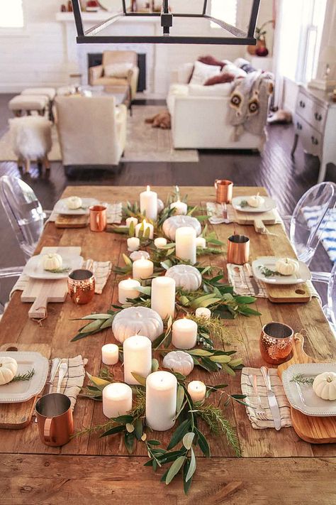 Fall table decorations are always so much fun to create! My favorite are neutral, simple, and elegant tablescapes that are easy but look high end. Check out these 15 neutral table settings for some wonderful Thanksgiving and fall table decor! Thanksgiving table decorations, thanksgiving tablescapes, and more #tablescape #thanksgivingdecorations #thanksgivingtable #falltablescape #falltabledecor Dining Table Candle Centerpiece, Fall Tables, Dining Table Candles, Thanksgiving Table Centerpieces, Simple Thanksgiving Table, Do It Yourself Decoration, Fall Dining Table, Fall Dining Room, Table Setting Ideas