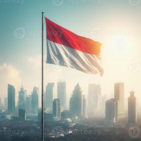 The red and white flag flies against a blue sky. Indonesian flag. Indonesian Independence day. Nationalism Indonesian Independence Day, Independence Day Photos, Indonesian Independence, Indonesian Flag, Red And White Flag, 17 Agustus, White Flag, White Sky, Cityscape Photos