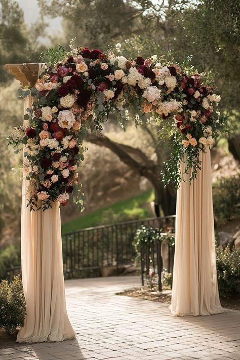 29 Boho Wedding Arch Ideas To Create A Dreamy Backdrop - Courtneys World Decorated Pergola For Wedding, Peony Arch Wedding, Flower Arch Wedding Outdoor, Roatan Wedding, Dark Wedding Aesthetic, Moody Boho Wedding, Fall Wedding Arch, Bohemian Wedding Backdrop, Wedding Arch Floral