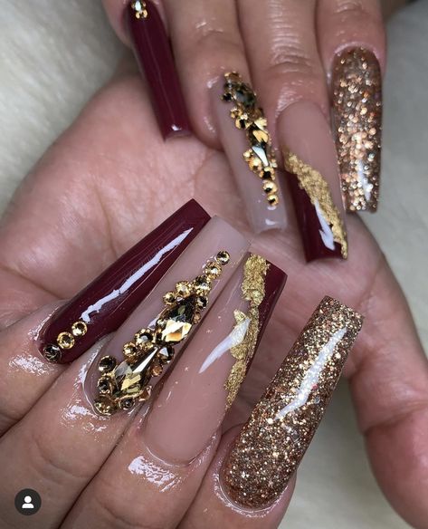 Maroon And Champagne Nails, Gold And Burgundy Prom Nails, Burgundy Gold Nails Acrylic, Prom Nails For Burgundy Dress, Burgundy Rhinestone Nails, Burgundy And Champagne Nails, Burgandy Prom Nails, Burgundy Nail Designs With Rhinestones, Burgundy Nail Designs Coffin