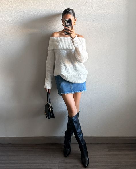 This Sydney Sweater is the one you grab when you want to look cute on a warm Autumn day. This lightweight pullover sweater features an off the shoulder neckline and a loose fit. Style it with a denim mini skirt and boots for the perfect Autumn 'fit! More Details: - Fits true to size for most - Does stretch - Pullover sweater - Slight oversized fit - Full length/not cropped - 100% acrylic - Color: Ivory - Color may vary due to the lighting - Model is wearing a size small styled with the Seren Den Sweater And Mini Skirt Outfit Fall, Chunky Sweater Mini Skirt Outfit, Sweater Over The Shoulder Outfit, Sweater Skirt Boots Outfit, Sweater And Jean Skirt, Oversized Sweater Skirt Outfit, Off The Shoulder Top Outfit Winter, Winter White Skirt Outfit, Skirt With Knit Sweater