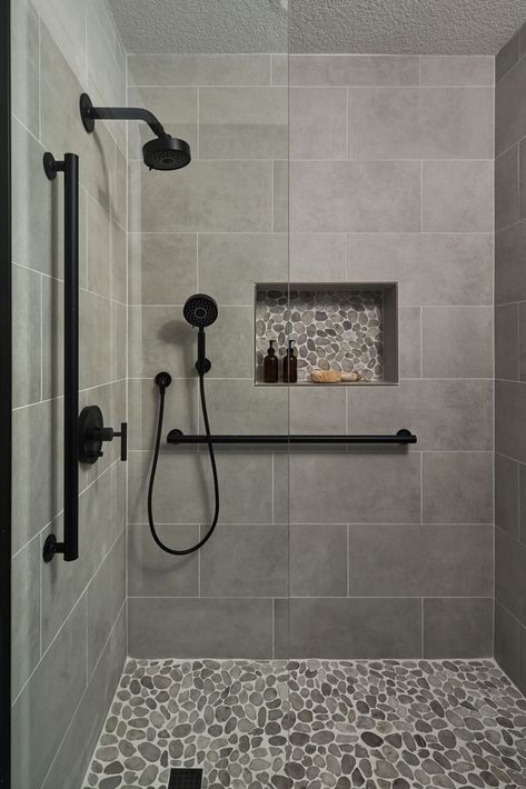 Bathroom Remodeling Ideas -  A transitional shower design with river rock floor and niche accent. Large format grey tile on the walls. Matte black fixtures. Restroom Remodel, Tub To Shower Remodel, Full Bathroom Remodel, Bathroom Redesign, Bathroom Remodel Designs, Bathroom Remodel Shower, Bathroom Inspiration Decor, Shower Remodel, Bathroom Design Small