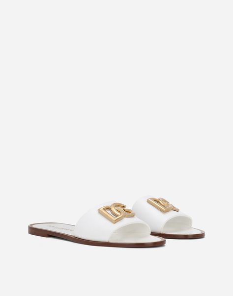 Find DOLCE & GABBANA Calfskin Sliders on Editorialist. Calfskin Bianca sliders with DG logo: White Branded leather sole and bottom assembly Item comes with a branded dust bag Made in Italy White Sliders, Women Slides, White Brand, Latest Shoes, Valentino Garavani, Sliders, White Leather, Patent Leather, Leather Sandals