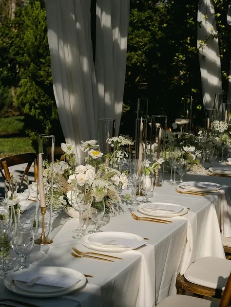 Long Table With Medium-Height White-and-Greenery Centerpieces, Taper Candles Under Drapery Wedding Long Table Flowers, Long Wedding Table Decorations, Long Table Decorations, Wedding Decor Trends, Long Table Centerpieces, Rustic Italian Wedding, Italian Inspired Wedding, Long Table Wedding, Reception Table Decorations