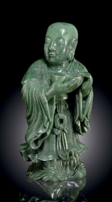 A LARGE SPINACH-GREEN JADE FIGURE OF A STANDING ATTENDANT - China Stone Age Art, Carved Gemstones, Chinese Sculpture, Jade Buddha, Antique Jade, Gemstone Carving, Gemstone Art, Chinese Jade, Carved Jade