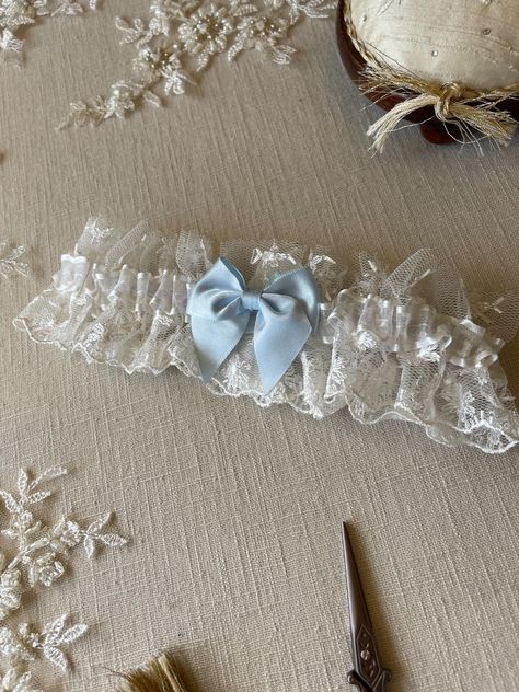 This pretty 'something blue' is a dainty ivory tulle, embroidered with flowers. Gently gathered, with a sheer, satin edged ribbon and a pretty blue bow. A lovely garter for your 'something blue'! Made in two comfortable sizes 14"-22" and a plus size 20"-26" the garter is designed to still have a little ruffle in the tulle when it's worn.  This garter would be beautiful with an ivory wedding dress! Your garter will be sent in pretty tissue, with a card for the bride. Usually in stock and dispatch Unique Garters Bridal, Something Blue Garter, Unique Something Blue Wedding, Something Old New Borrowed And Blue, Something Blue Ideas, Unique Garter, Wedding Something Blue, Gifts For The Bride, Bride Garter