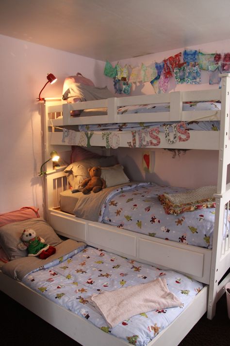 Christmas Bedding- triple bunk bed in girls room with their cozy PBKids Christmas duvets. Bedroom Ideas For 3 Sisters Small Room, 3 Sister Room Ideas, Room Ideas For 3 Sisters, 3 Bunk Bed, Small Room For 3 Sisters, Small Room 3 Beds, Triple Bunk Room, Small Bedroom Ideas For 3 Sisters, Room For 3 Sisters