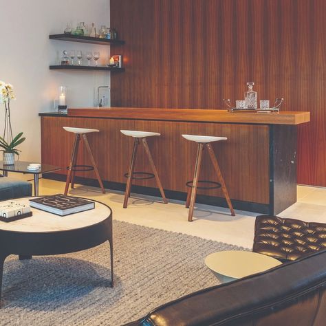 A beautiful walnut veneer and black leather marble bar with cold rolled steel shelves. #modus_ap #bookmatch #design #interiors #midcentury #custom #architecture Mid Century Modern Basement Bar, Modern Basement Bar, House Aesthetics, Steel Shelves, Mid Century Modern Bar, Modern Basement, Marble Bar, Cold Rolled Steel, Espresso Bar