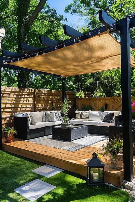 Outdoor patio with shaded pergola, wicker furniture, cushioned seating, accent pillows, hanging plants, and a wood deck surrounded by greenery. Small Deck Shade Ideas, Create Shade In Backyard, Shade Ideas For Backyard, Shade In Backyard, Backyard Shade Ideas, Small Back Gardens, Small Backyard Decks, Deck Shade, Shade Ideas