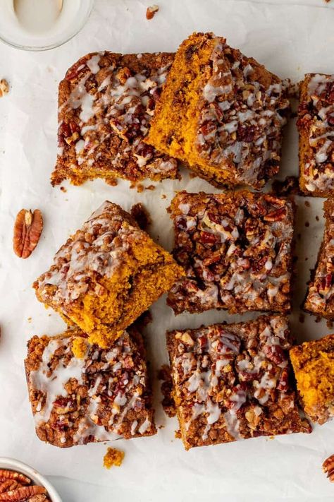 A moist and flavorful pumpkin coffee cake with pecan crumble and a cinnamon swirl in the center is made with pumpkin and warm spices.