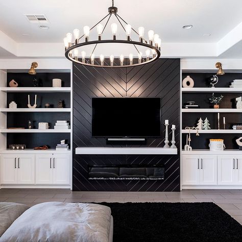 When black and white is the vibe 🖤🐇 It’s pretty cool that I get to design and build spaces like these. Sometimes the “I love my job”… | Instagram Feature Wall With Tv And Electric Fireplace, Tv Wall Black And White, White And Black Built Ins, Loft Built Ins With Tv, Black And White Entertainment Center, Modern Black And White Fireplace, Black Wall White Shelves, White Black Media Wall, Basement Black And White