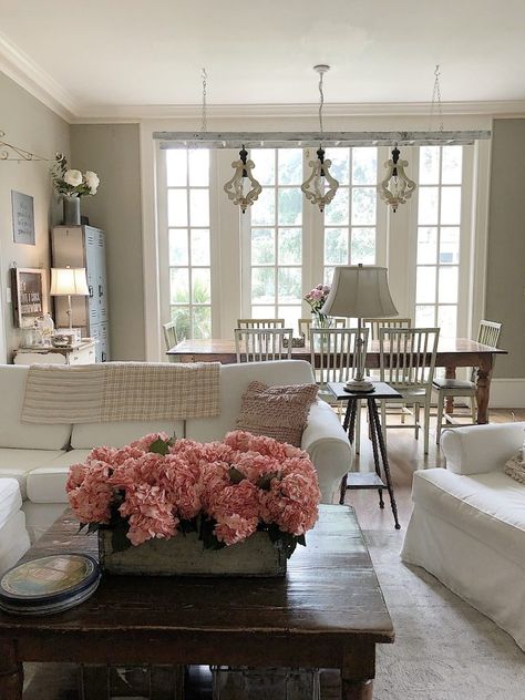 I love adding color to my home. For summer, I added pink blush to our family room with flowers, pillows and artwork. Rustic Livingroom, 100 Year Old Home, Rustic Farmhouse Living Room, Family Room Walls, Farmhouse Renovation, Behr Paint, Old Home, Room Paint Colors, Paint Colors For Living Room