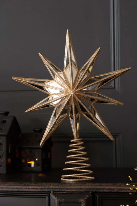 Christmas tree topper of a champagne gold star with mirrored segments, on a spiral base. Chinoiserie Christmas Tree, Gold Star Tree Topper, Unusual Christmas Decorations, Gold Tree Topper, Unusual Christmas Trees, Star Christmas Tree Topper, Christmas Champagne, Xmas Tree Toppers, Christmas Tree Star Topper